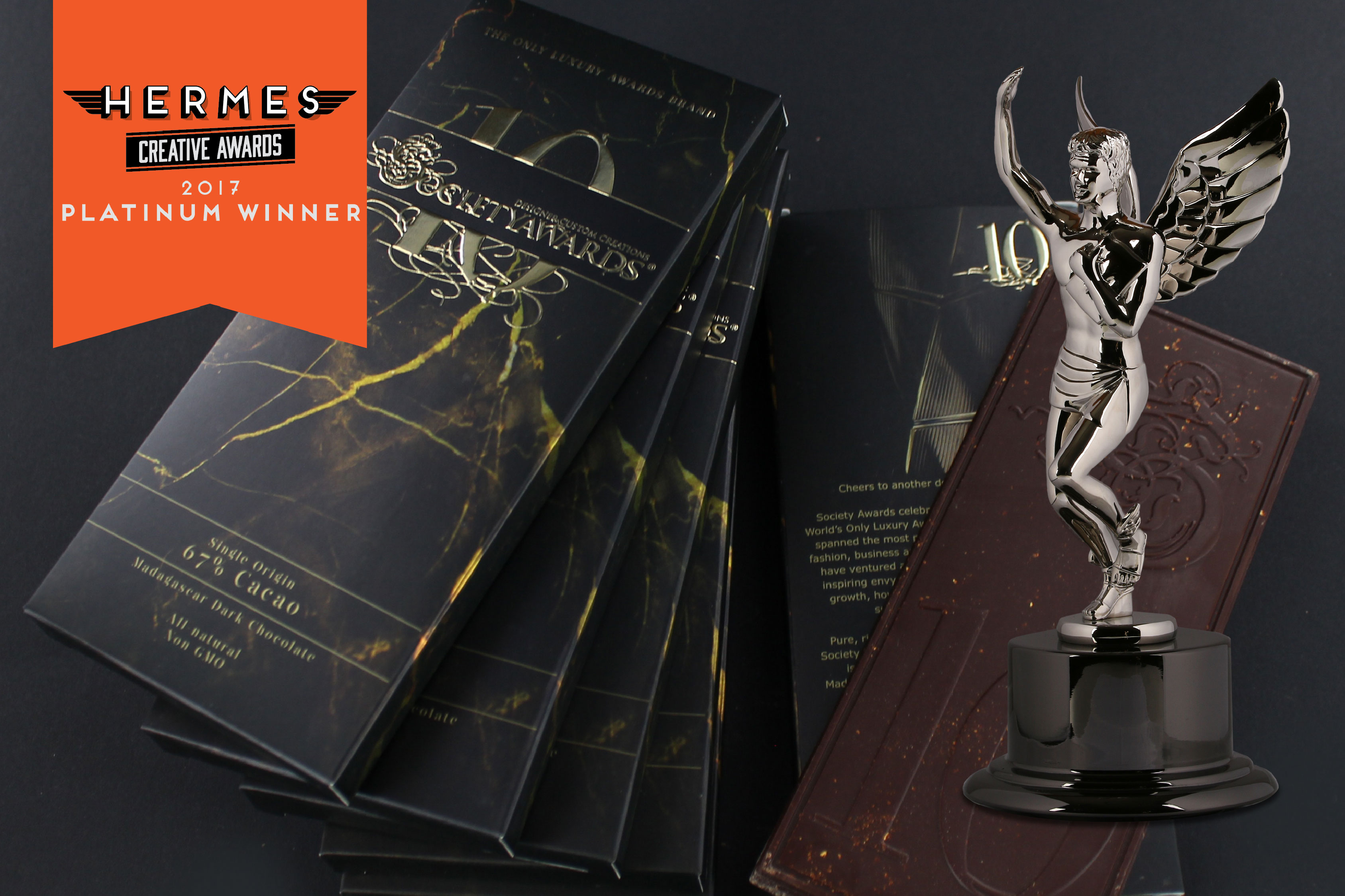 Stack of custom chocolate bar boxes designed by Viceroy Creative for our 10 Year Anniversary Chocolate. Also, image of Hermes award
