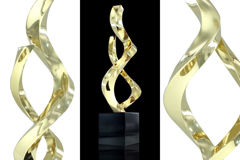 3 views of limited edition Ribbons 1 award. Design has two twisting gold-plated bands rising out of a black metal base
